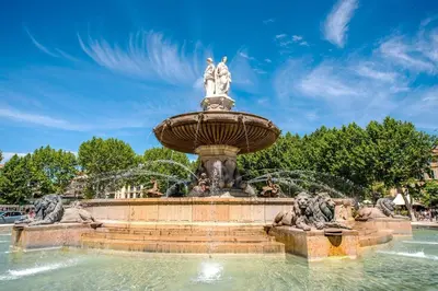 a fountain with two statues on top of it at Chez Florence - Appartement T2 d au cœur du centre ville historique - Proche Cardeurs et Mairie in Aix-en-Provence