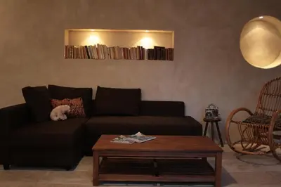 a living room with a couch and a coffee table at Les Gites de Catherine in Gargas