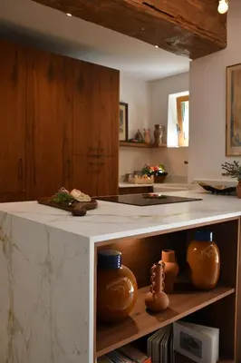 a kitchen with a counter with pottery on it at La Piscine dans la Foret in Gordes