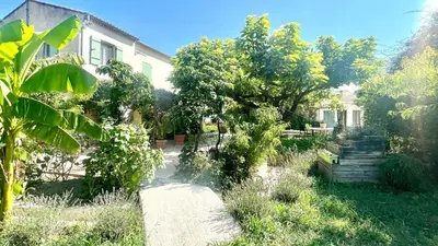 a house with a garden with trees and a pathway at Rendez-vous en Provence -10 personnes- duo de gîtes- piscine privée - clim in Cheval-Blanc