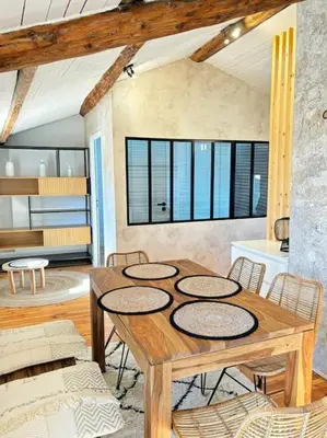 a dining room with a wooden table and chairs at Le Scandinave in Aix-en-Provence