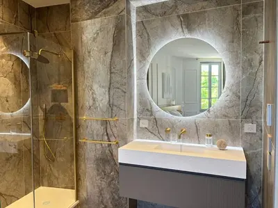 a bathroom with a sink and a mirror at Le Pénélope in Aix-en-Provence