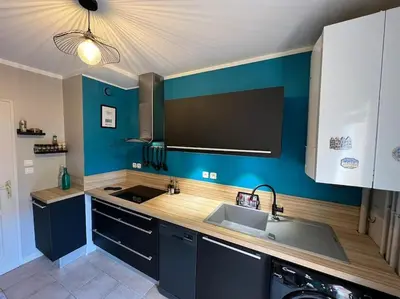 a kitchen with a sink and a counter top at La Villa Nawengo in Le Thor