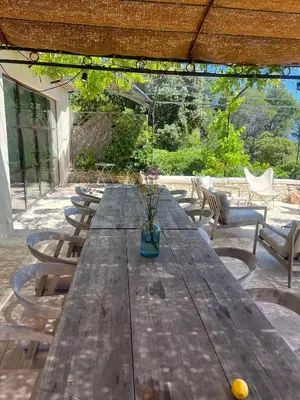 a bedroom with a bed with a desk and a chair at Mas du Loriot in Murs
