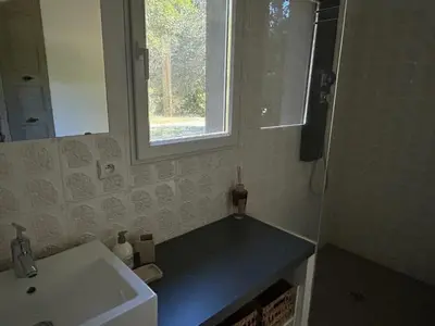 a bathroom with a sink and a window at Studio Estrella - Studio 2 personnes - Domaine Astra, Grans in Grans