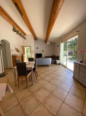 a large living room with a table and chairs at Maison de Vacances en Provence in Venasque