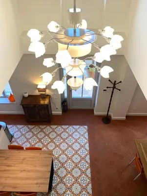 an overhead view of a living room with a chandelier at Le grand mas du Couchadou in Pernes-les-Fontaines