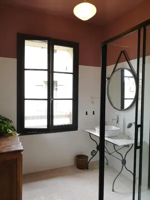 a bathroom with a sink and a mirror at Maison provençale, piscine, calme et Lubéron in Le Thor