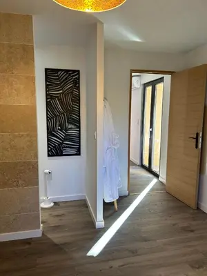 a hallway with a hallwayngth at Logis du Vert Moulin Premium in Le Puy-Sainte-Réparade