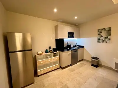 a kitchen with a stainless steel refrigerator in it at Appartement au coeur du centre historique in Aix-en-Provence