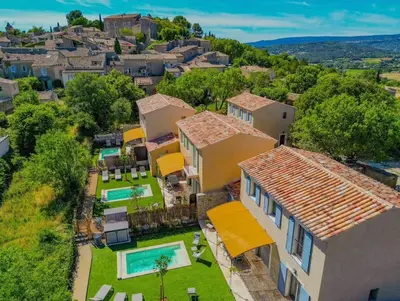 an aerial view of a house with a yard at Villa Lisette, un meublé de tourisme 3 étoiles au cœur de Goult in Goult
