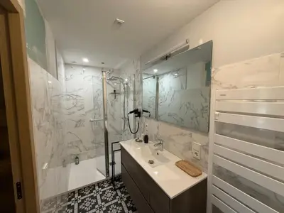 a white bathroom with a sink and a shower at Moulin AURELIA - chambre La Coloniale in Pélissanne