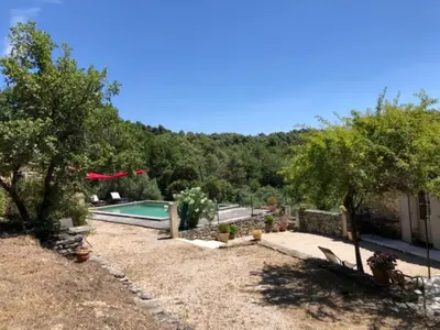 a backyard with a swimming pool and trees at Holiday Home in Lacoste with Pool in Lacoste