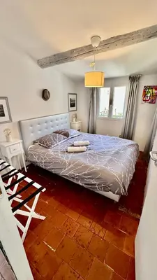 a bedroom with a large bed in a room at artist plein centre ville historique in Aix-en-Provence