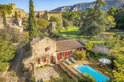 an aerial view of a villa with a swimming pool at Villa Le Bastidon by Villa Plus in Les Taillades
