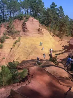 a group of people standing on top of a dirt hill at Location avec piscine Roussillon LS2-91 in Roussillon