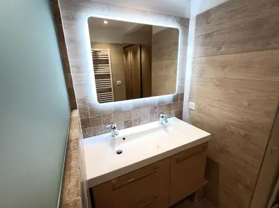 a bathroom with a sink and a mirror at Superbe appartement neuf au cœur de la Provence. in Entraigues-sur-la-Sorgue