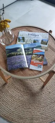 a glass table with magazines on top of it at Le Cosy Luberon - Viens in Viens