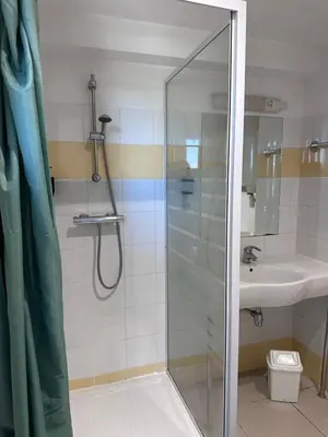 a bathroom with a shower and a sink at Le Clos d'Aix studio 106 parking in Aix-en-Provence