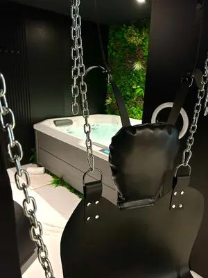 a swing in front of a bath tub at BDSM TANTRA Love Room Salon-de-Provence in Salon-de-Provence