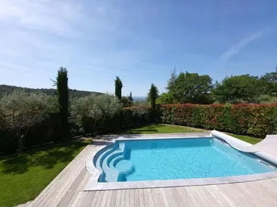 a swimming pool in the yard of a house at L'escapade provençale in Lioux