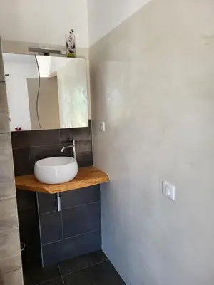 a bathroom with a sink and a mirror at L'escapade provençale in Lioux