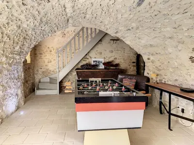 a kitchen with a table and a staircase in a building at Authentique mas avec vue et piscine Eygalieres LS1-447 in Eygalières