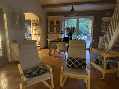 a kitchen with a table and chairs and a dining room at Villa Provençale climatisée près Aix en Provence Piscine securisée alarme in Ventabren