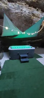 a ping pong table with lights and a tent at La bonne adresse de Provence in Cornillon-Confoux