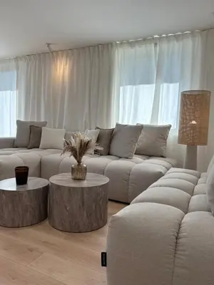 a living room with two couches and two tables at Appart 'COSY avec Piscine Chauffée Privée in Salon-de-Provence