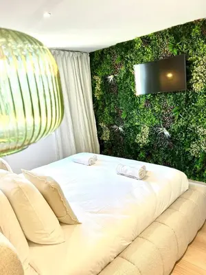 a bathroom with a round mirror and a sink at Appart 'COSY avec Piscine Chauffée Privée in Salon-de-Provence