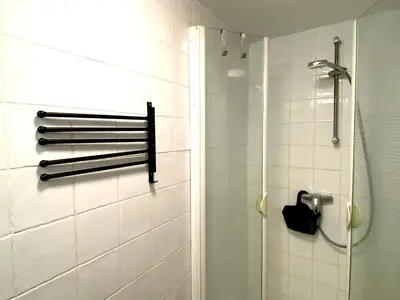 a bathroom with a shower and a glass door at EDEN l Jardin, Bbq, Duplex l Parking Gratuit & Super Wifi l Vue Panoramique Sainte-Victoire in Aix-en-Provence