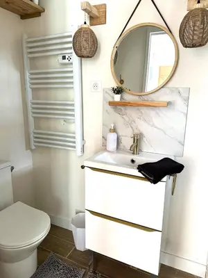 a bathroom with a sink and a mirror at La maisonnette de Tom in Caumont-sur-Durance