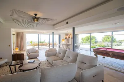 a living room with a couch and a pool table at 8-bedroom luxury villa with pool in Gordes