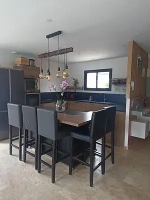 a kitchen with a dining room table and chairs at maison en Provence pour un été sous le soleil in LʼIsle-sur-la-Sorgue