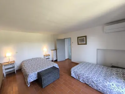 a hotel room with two beds and two lamps at Le Mas des iscles Mallemort in Mallemort