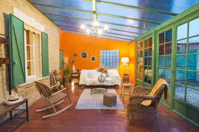 a living room with a couch and chairs at Mas des Olivades - Ferme Provençale - Piscine in Pernes-les-Fontaines