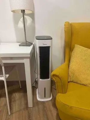 a room with a desk and a chair next to a lamp at Bel Appartement dans le centre d'Aix-en-Provence in Aix-en-Provence