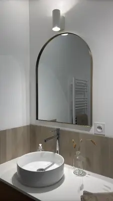 a bathroom sink with a large mirror above it at Le Granier location in Robion en Luberon