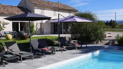 a bathroom with a shower with a glass door at Domaine du Piol - Luberon - Piscine privée - Clim - Beach Volley in Mazan