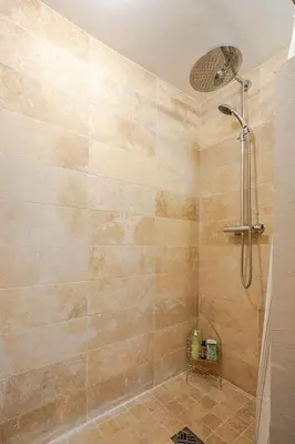 a bathroom with a shower with a shower head at Ecrin au cœur d'Aix-Vue sur la Place de la Mairie in Aix-en-Provence