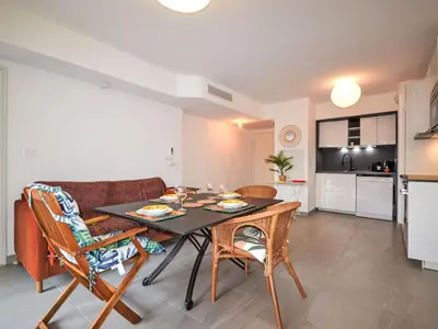 a dining room and kitchen with a table and chairs at Apartment Pigonnet by Interhome in Aix-en-Provence
