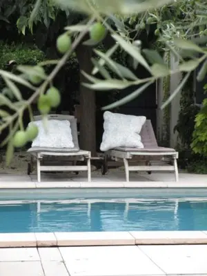 two chairs sitting next to a swimming pool at 