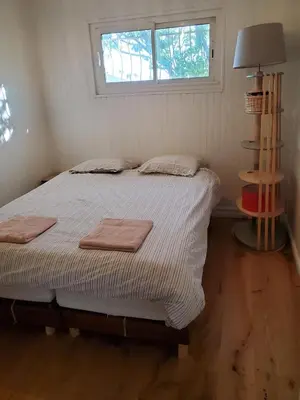 a bedroom with a bed with two towels on it at Charming house near village with 5-minutes pedestrian access to old town in Venelles