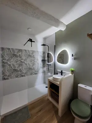 a bathroom with a sink and a toilet and a tub at Escapade sur la Sorgue in LʼIsle-sur-la-Sorgue