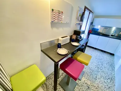 a coffee maker sitting on a counter next to a box at Sejour paisible au Thor in Le Thor