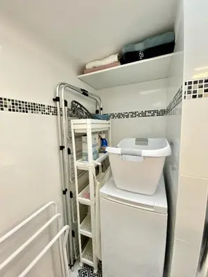a small bathroom with a toilet and a shelf at Sejour paisible au Thor in Le Thor