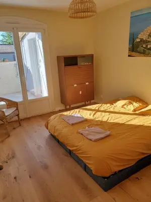 a bedroom with a bed with two towels on it at Charming Famillial House with pedestrian access to Village in Venelles