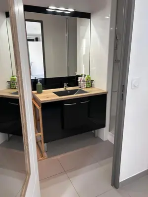 a bathroom with a sink and a mirror at Les escapades Provençales in Aix-en-Provence