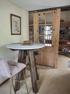 a table with a bowl on top of it in a room at La Maison perchée - Mas de Rousseau in Eyragues